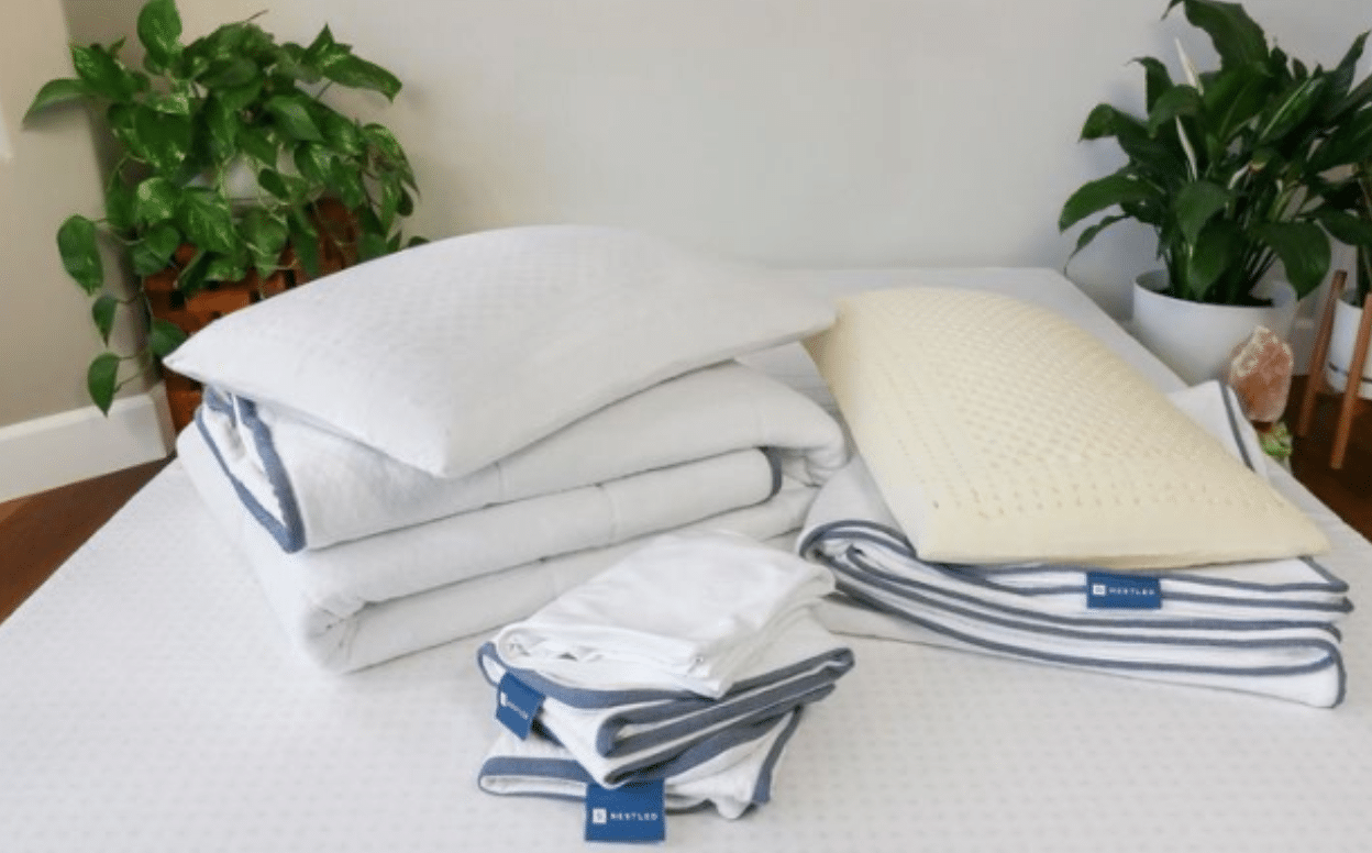 Mattress Toppers, sheets, and pillows on a Naturally Nestled mattress