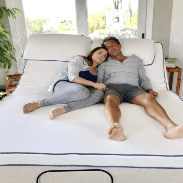 A couple sleeps on a mattress topper made of sustainable latex